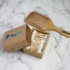 PayPal box, Gillette brush, and cotton swabs on marble