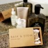 Assorted skincare products on a granite countertop