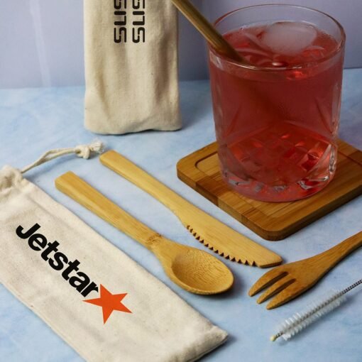 Iced drink in glass, bamboo utensils, Jetstar branded pouches.