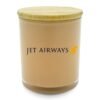 Jet Airways branded beige candle with wooden lid