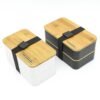 Two modern branded bento boxes with bamboo lids.
